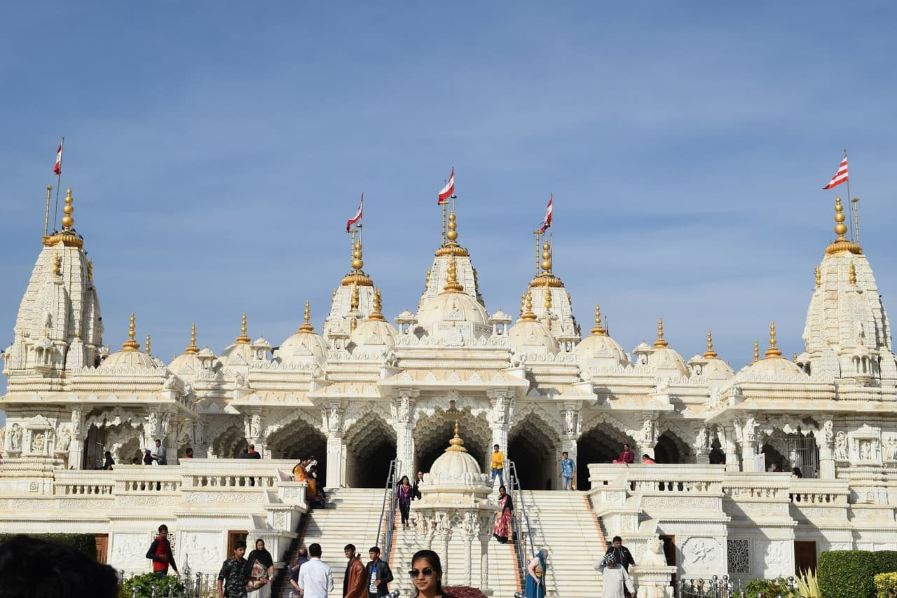 A white temple in Bhuj with carved spires