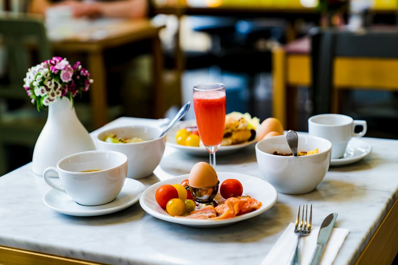 Tea and a light breakfast on a white table