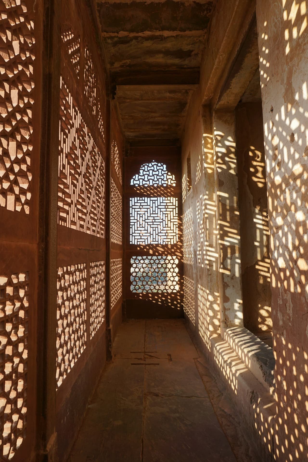 Light falling through carved stone screens