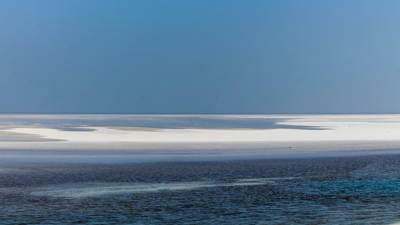 The Rann at blue hour, with a thin layer of water over the salt